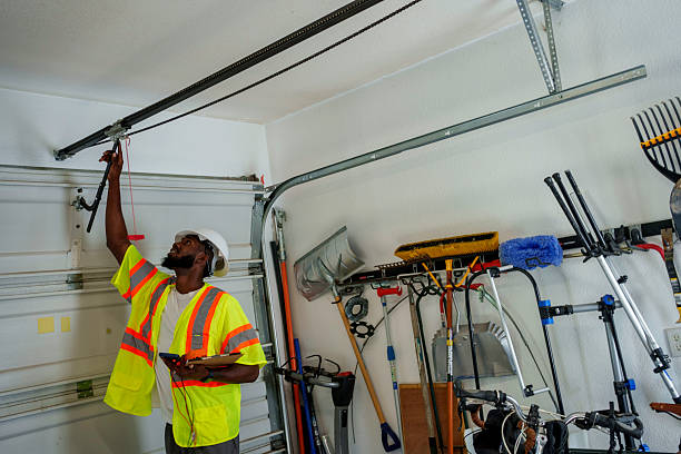 Professional Garage Door Panel Replacement technician working in Tiffin, IA